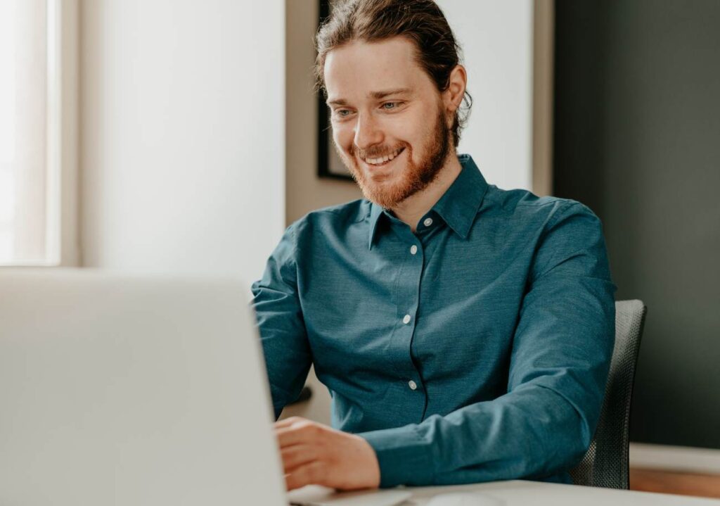 young man looking at the laptop