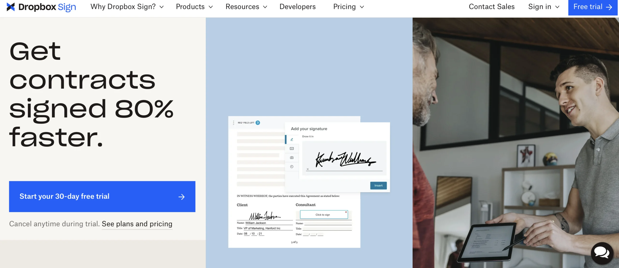 dropbox landing page showing a person signing a document
