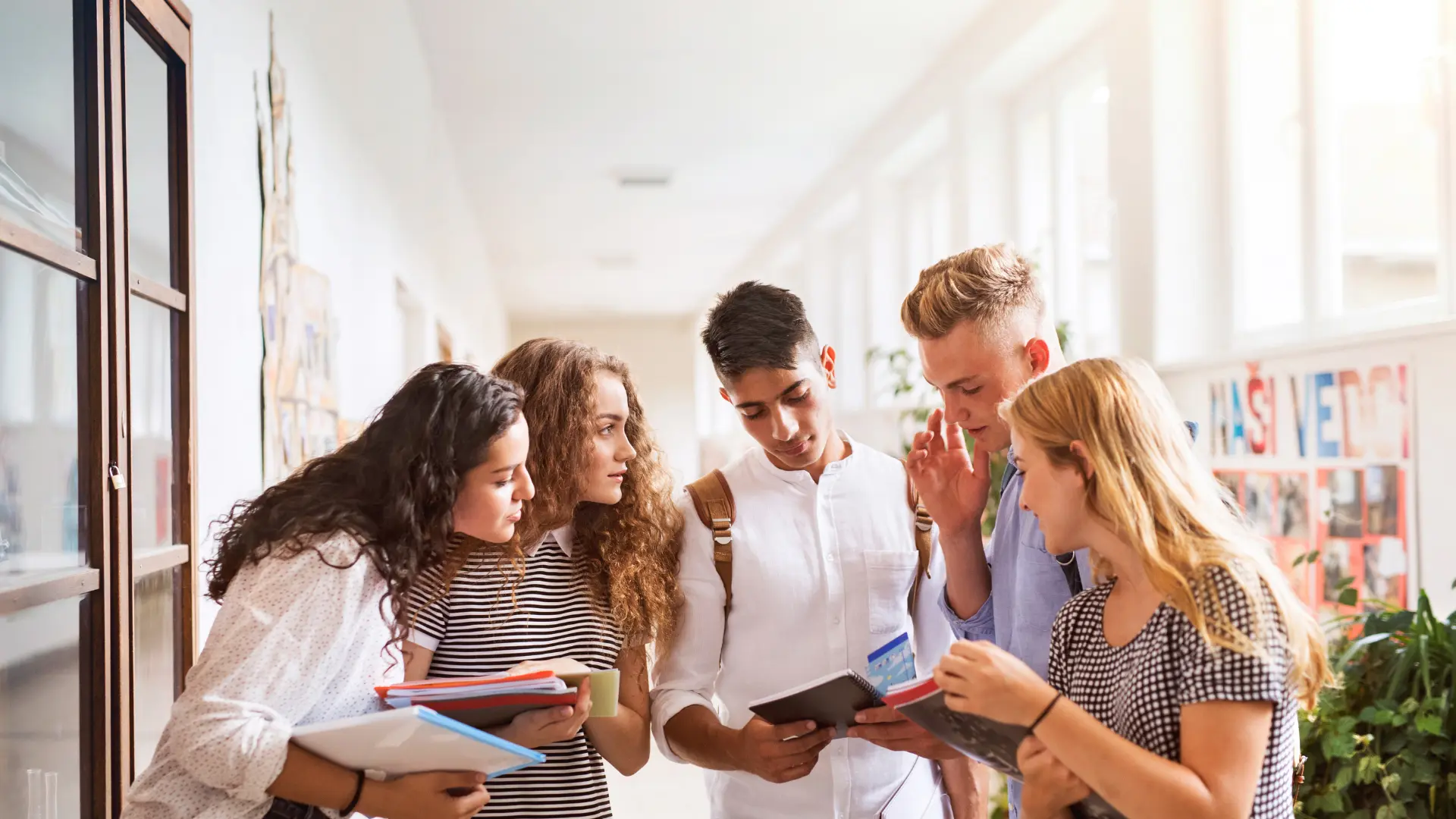 students in the school corridor with a teacher